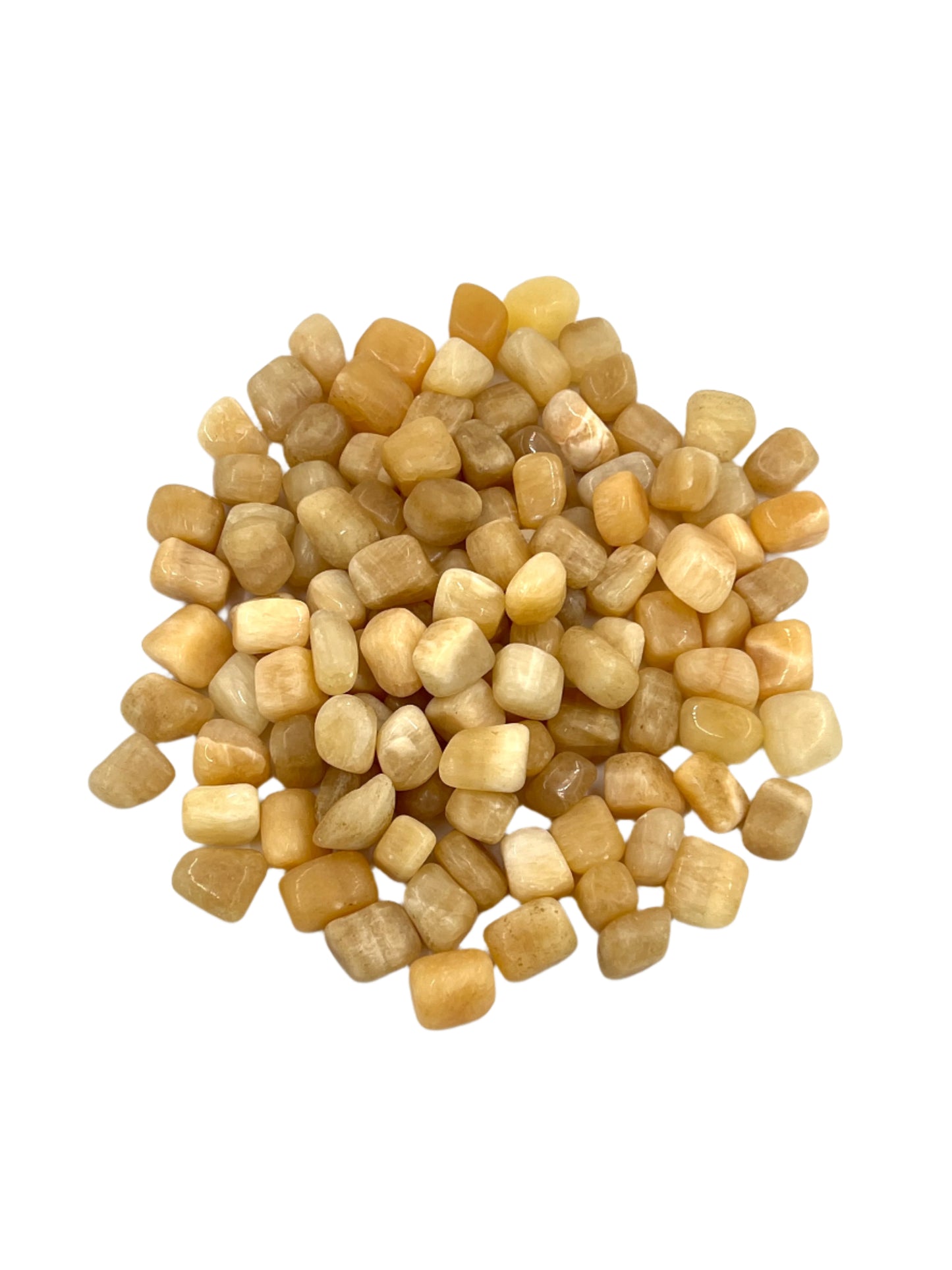 Small beige stones on a white background