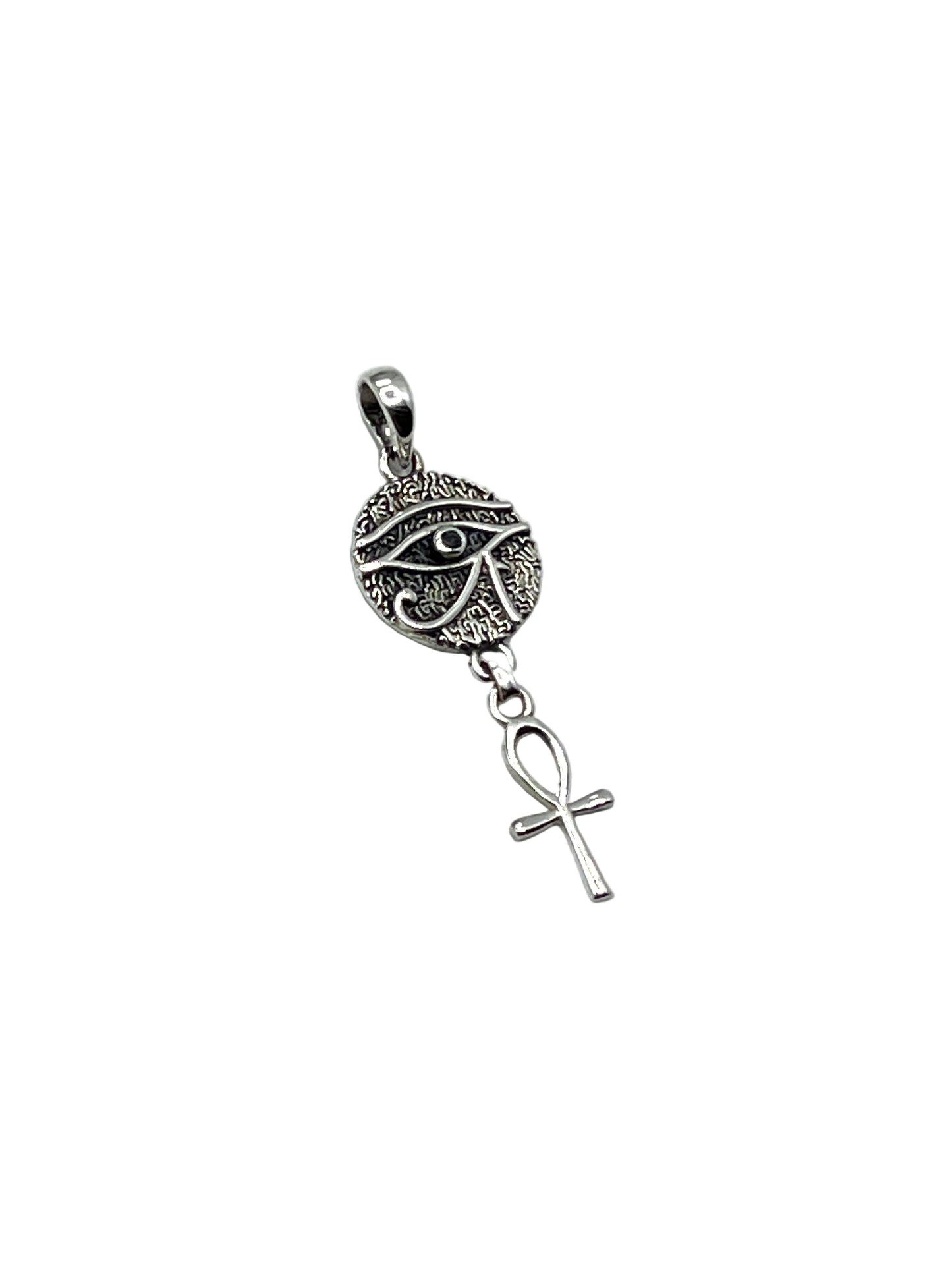 Silver pendant with eye design and ankh symbol on a light gray background