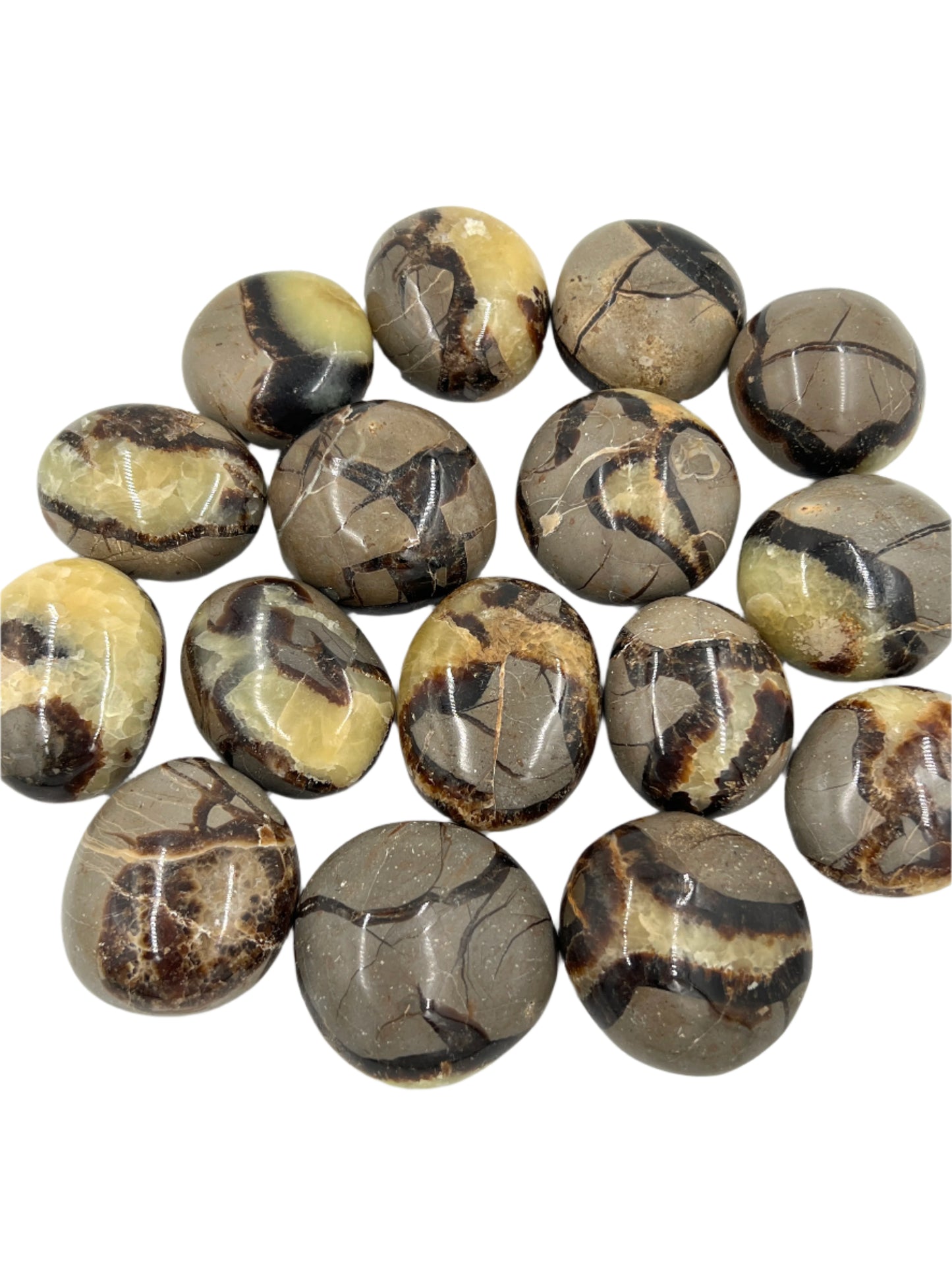 Collection of marbled stone beads on a white background