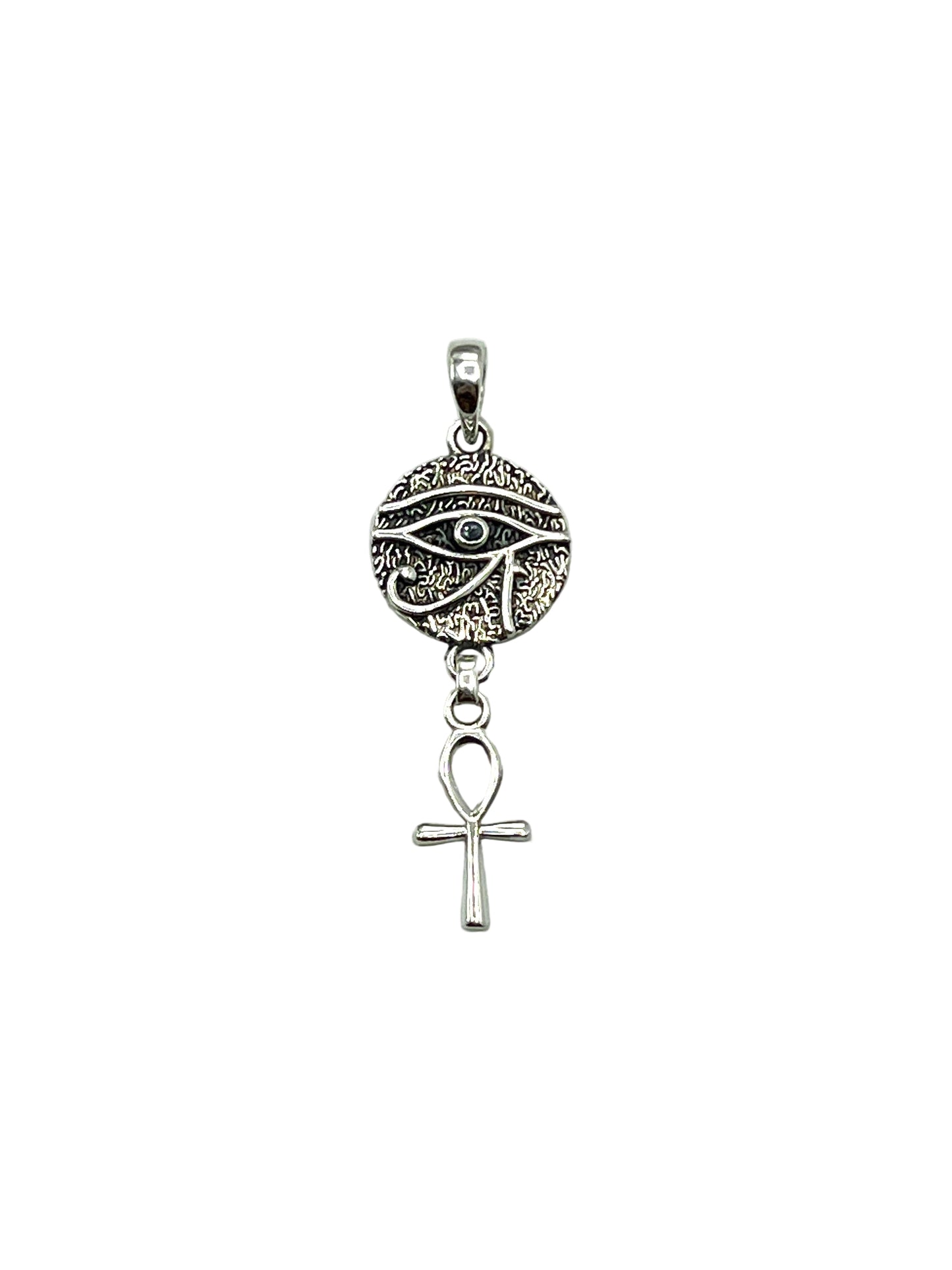 Silver pendant with eye design and ankh symbol on a light gray background