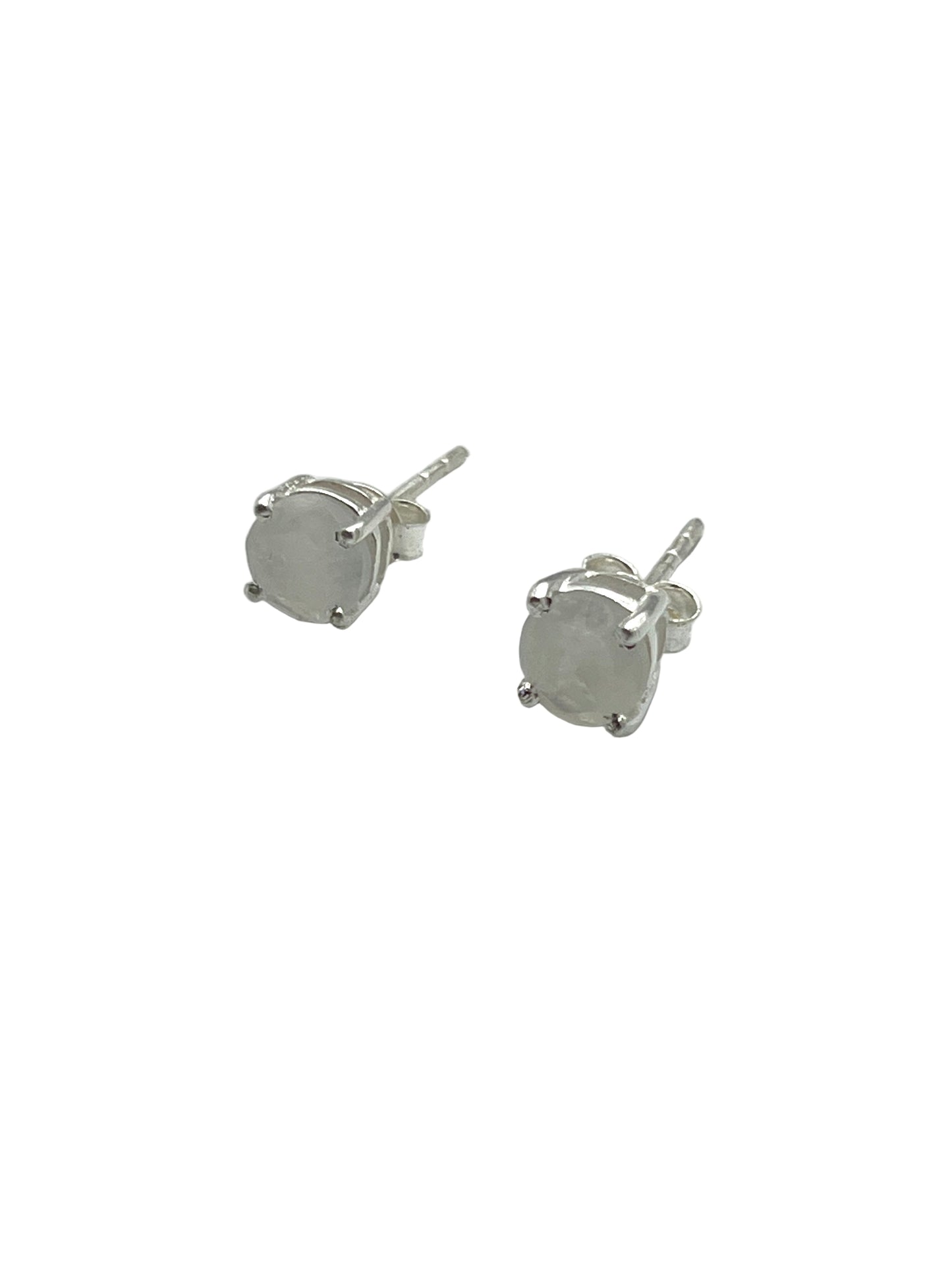 Pair of silver stud earrings on a white background