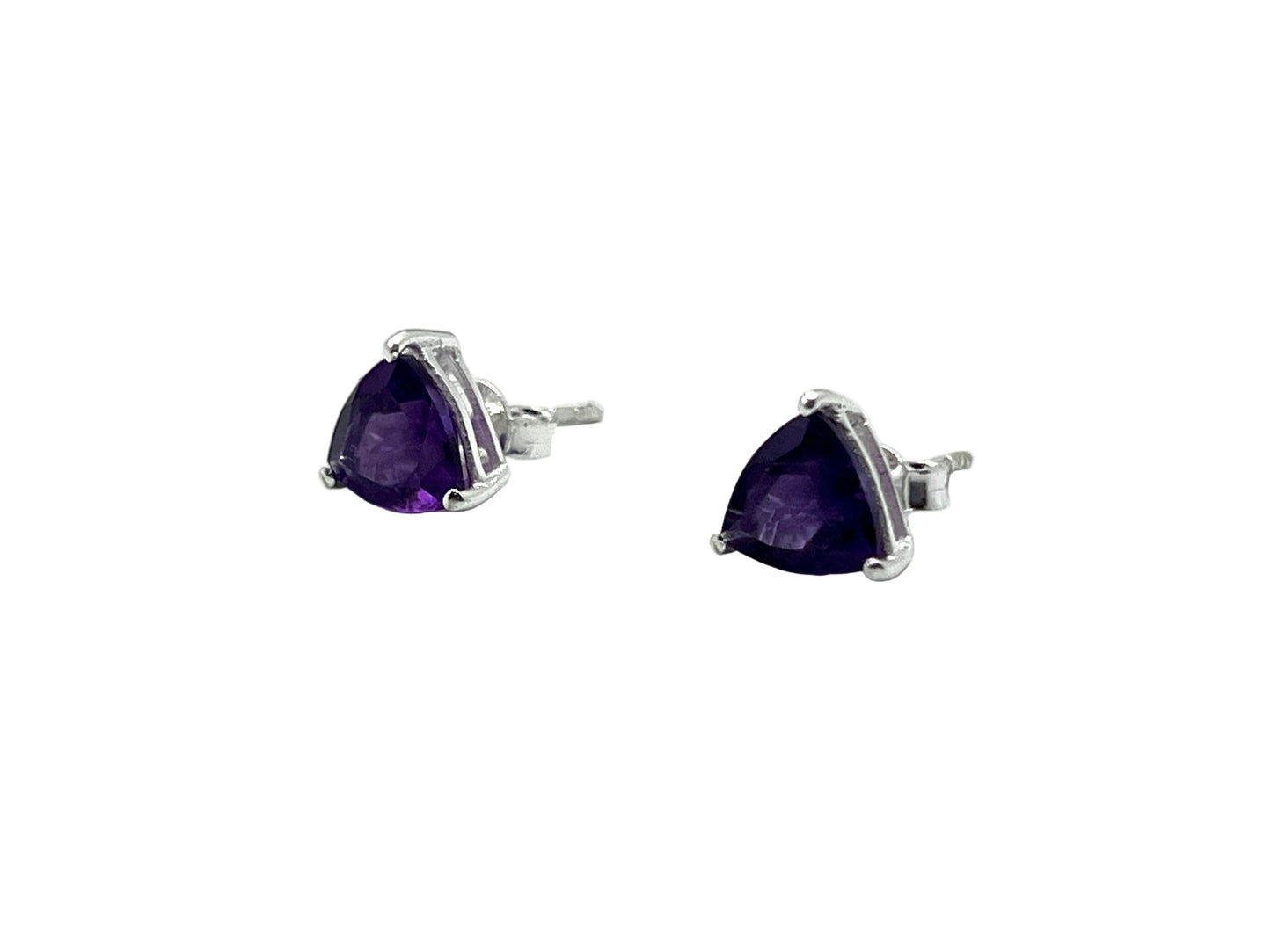 Pair of silver earrings with purple gemstones on a white background