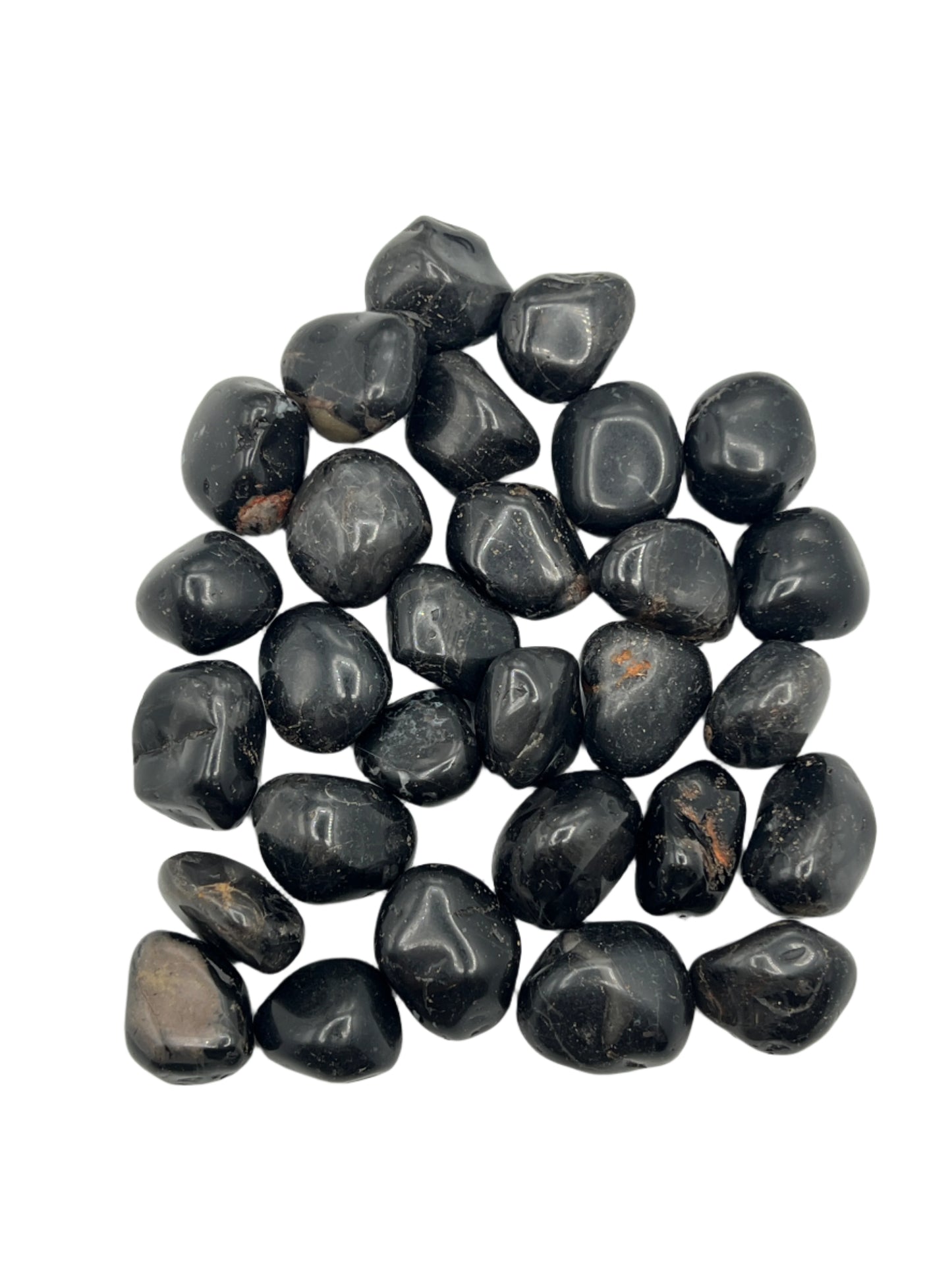 Collection of black onyx stones on a white background