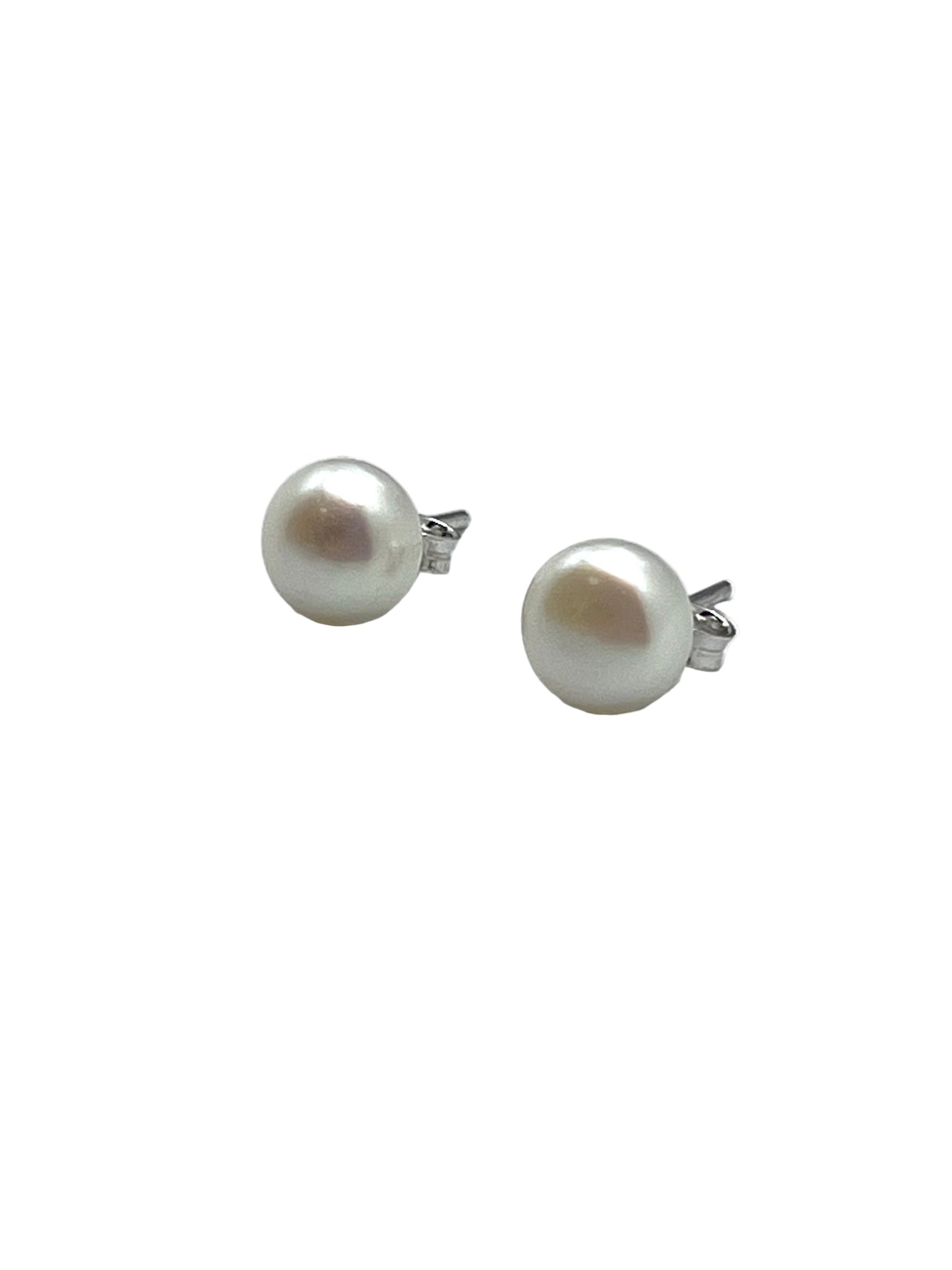 Pair of pearl stud earrings on a white background