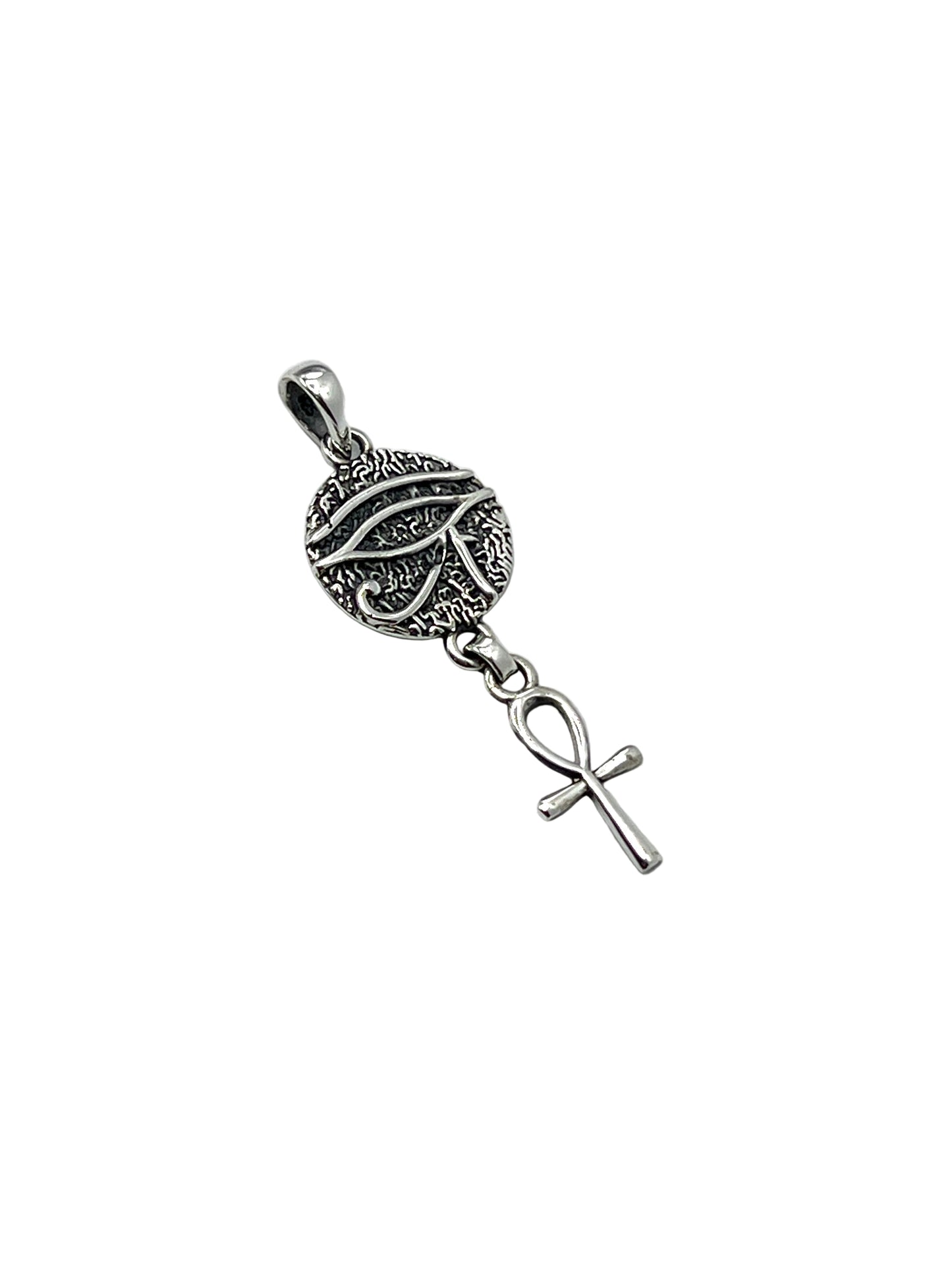 Silver pendant with horus eye and anhk on a white background