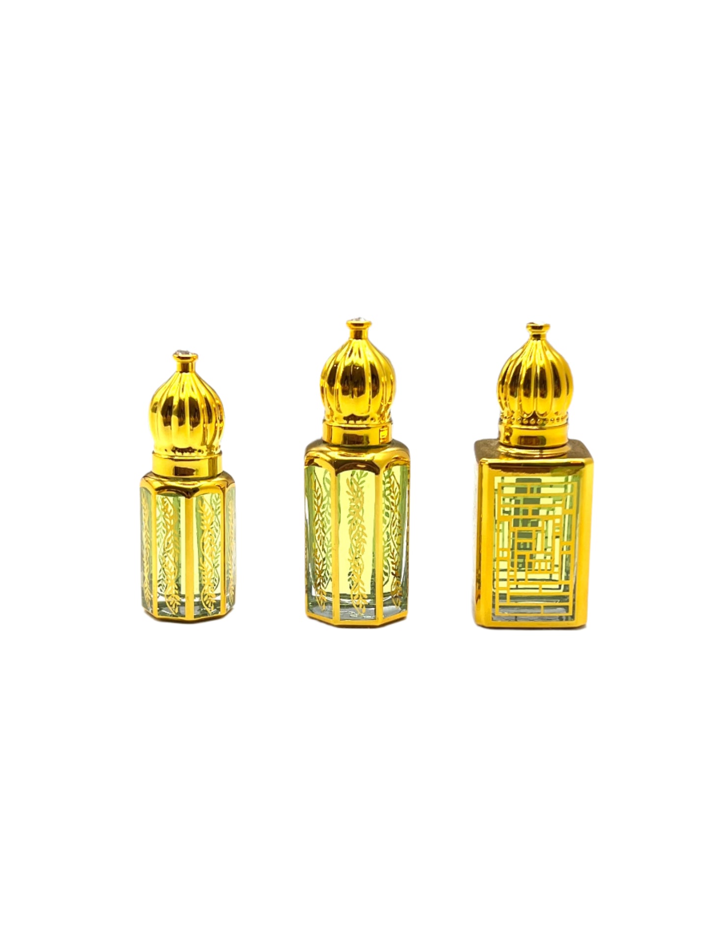 Three gold perfume bottles with intricate designs on a white background