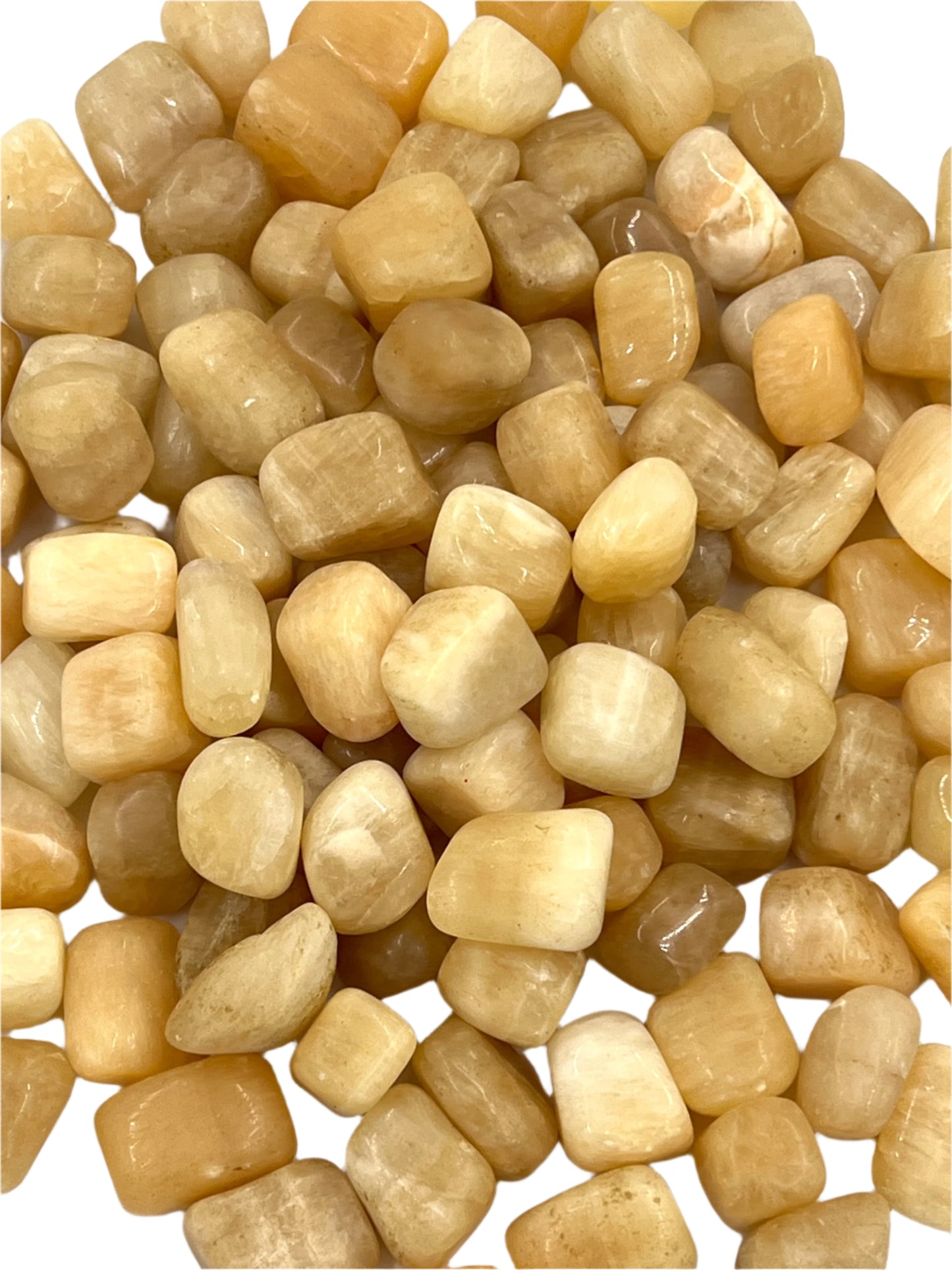 Close-up of small beige stones on a white background