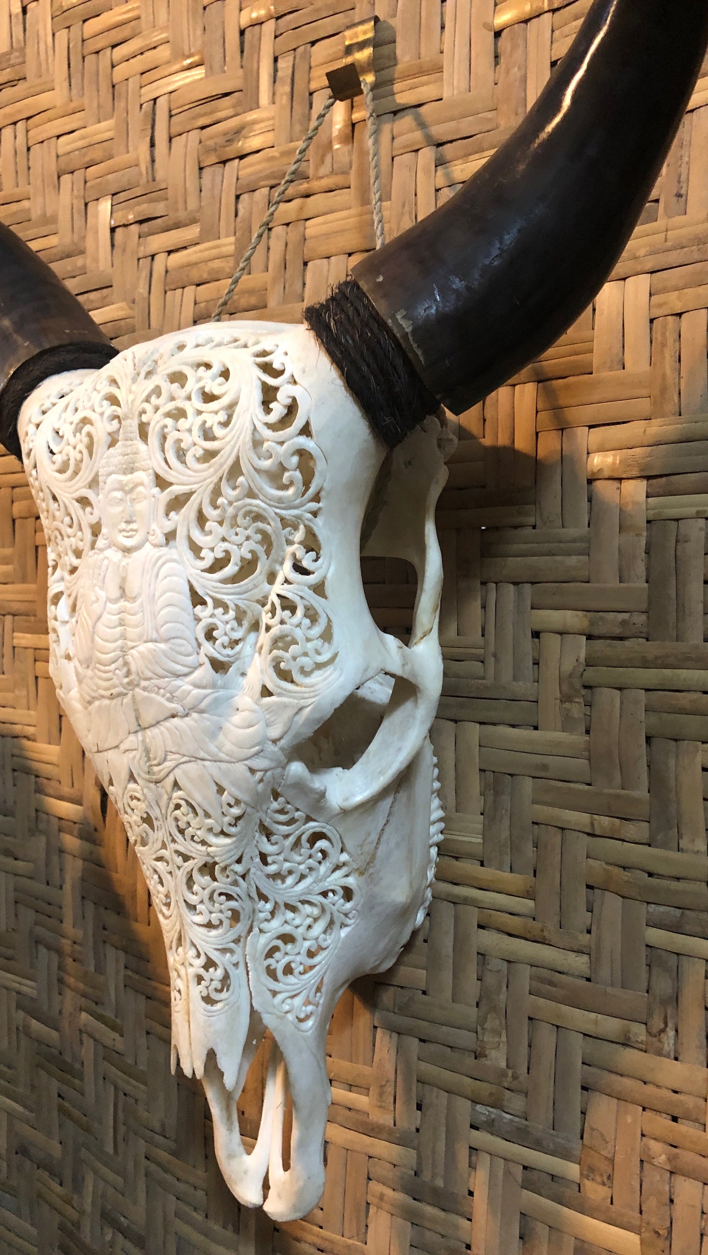 Intricately Carved Buffalo Skulls with Buddha