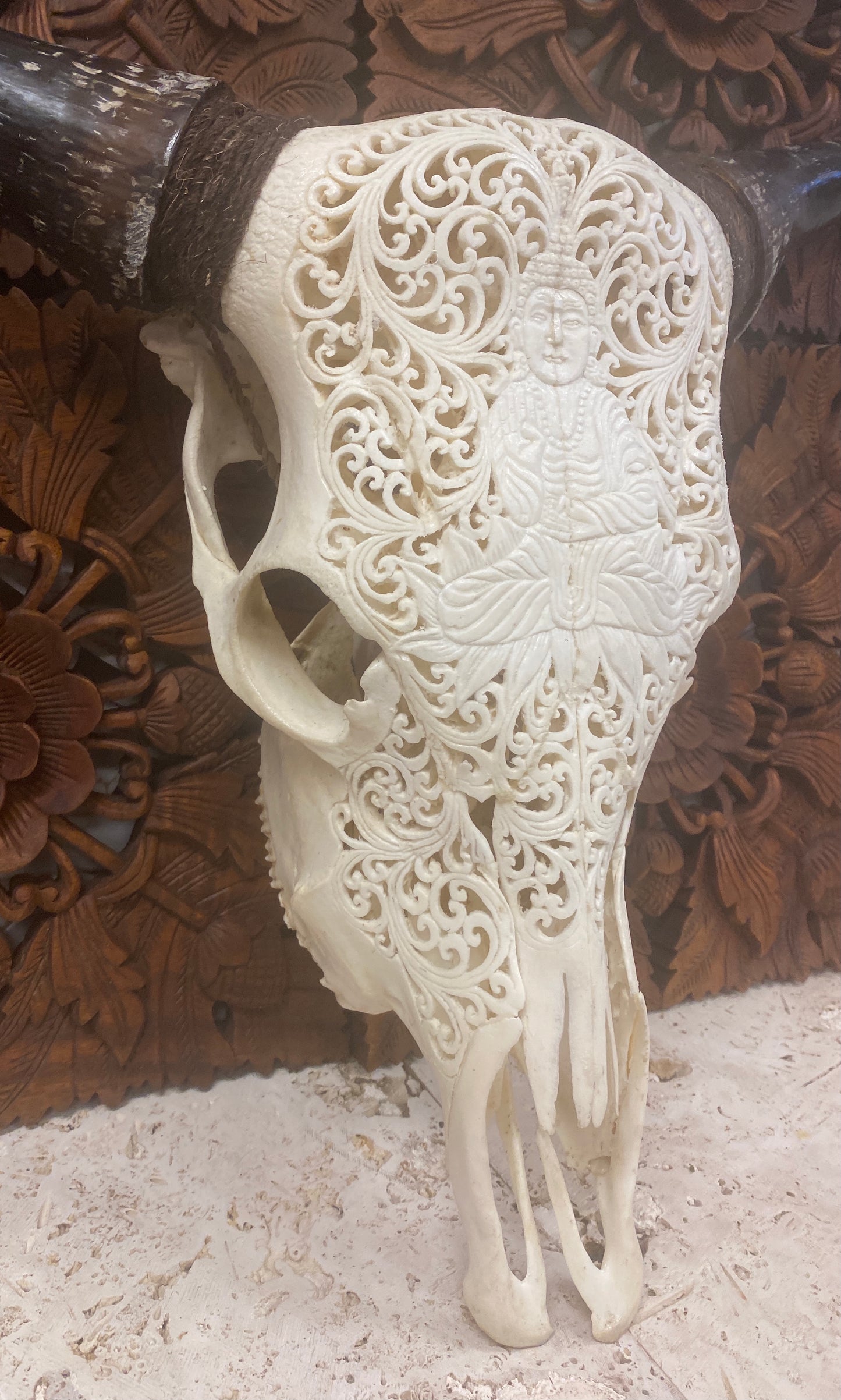 Intricately Carved Buffalo Skulls with Buddha