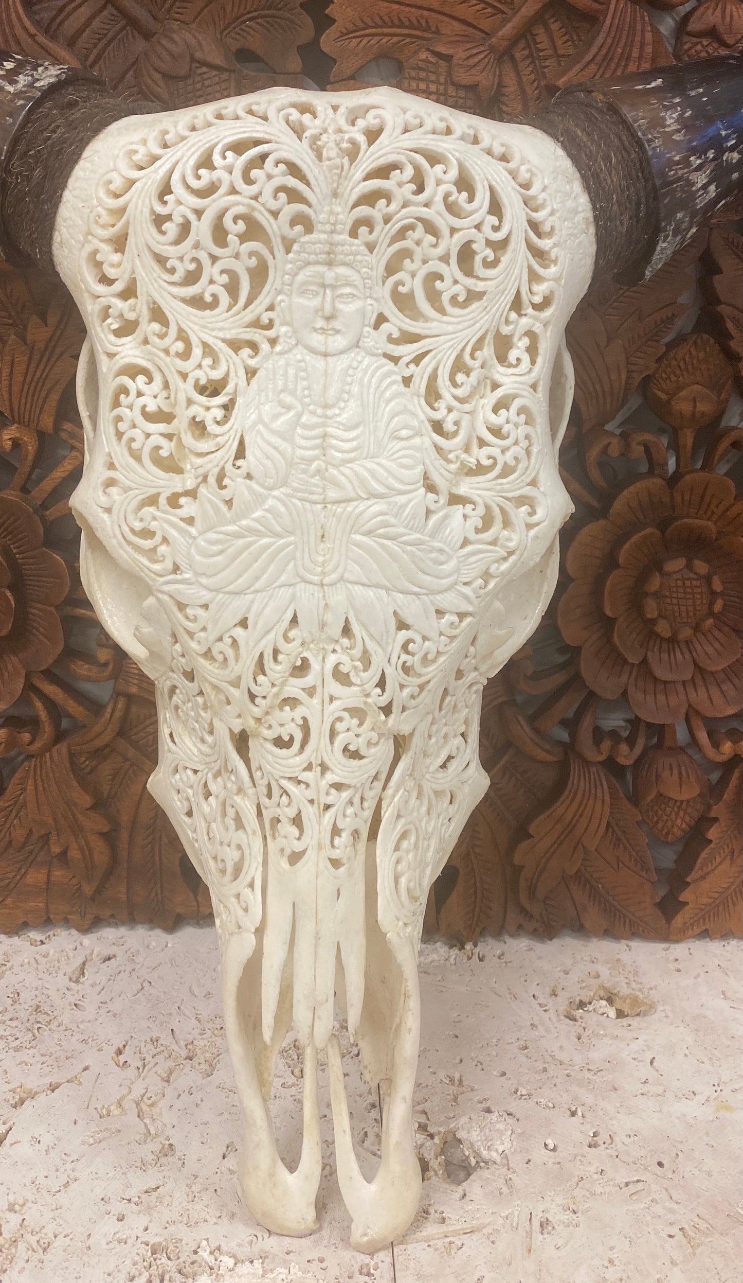 Intricately Carved Buffalo Skulls with Buddha
