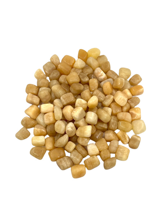 Small beige stones on a white background