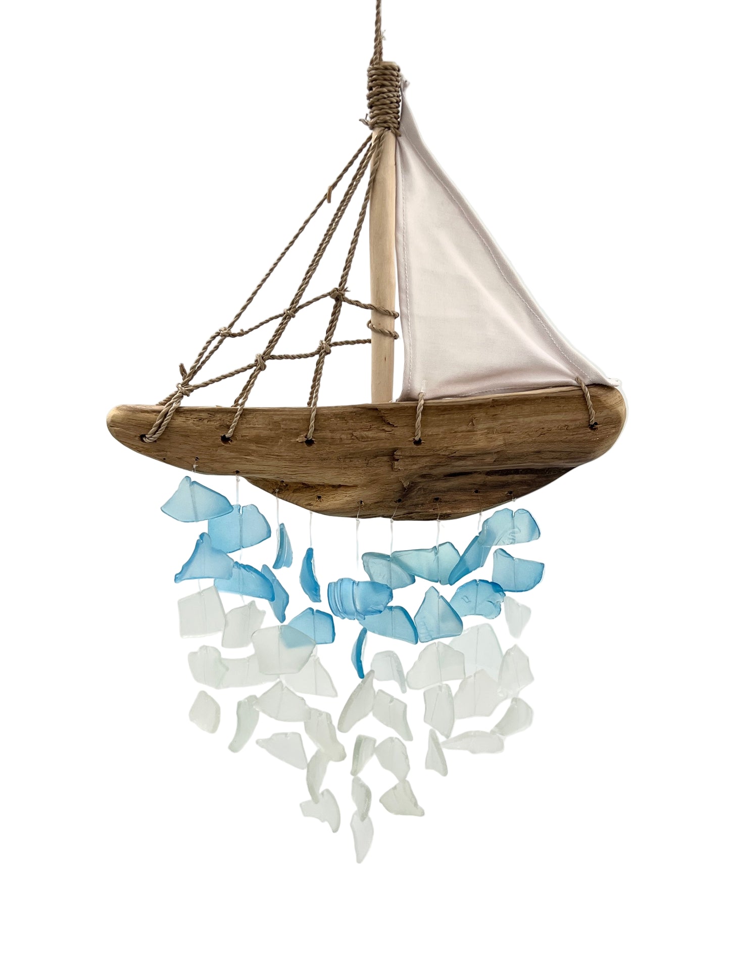 Decorative sailboat made of wood and rope with blue and white glass pieces on a white background