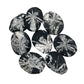 Black stones with white floral patterns arranged on a white background