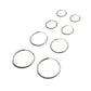 Set of silver hoop earrings on a light gray background