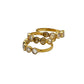 Two gold rings with embedded stones on a white background