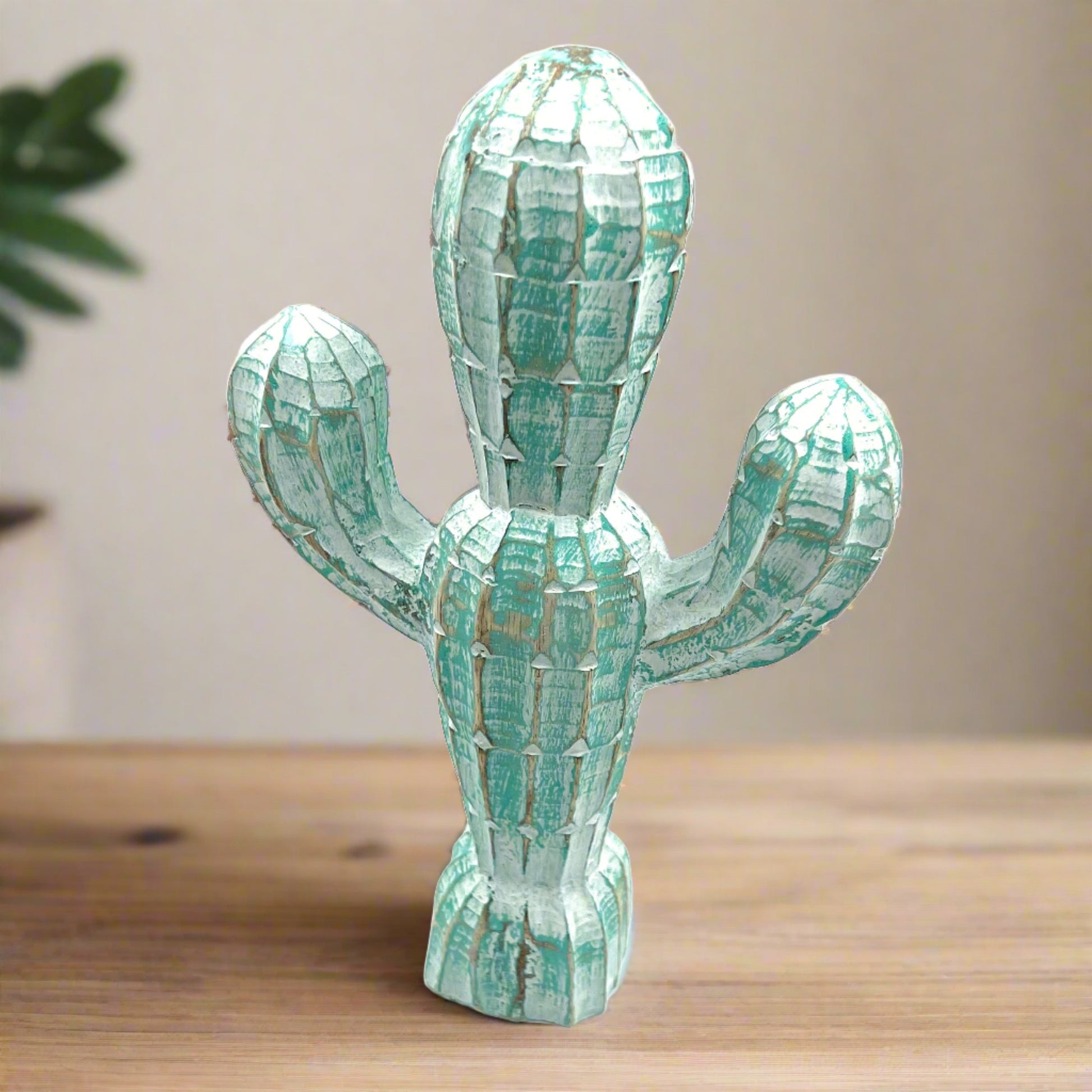 blue hand carved wood cactus, side view