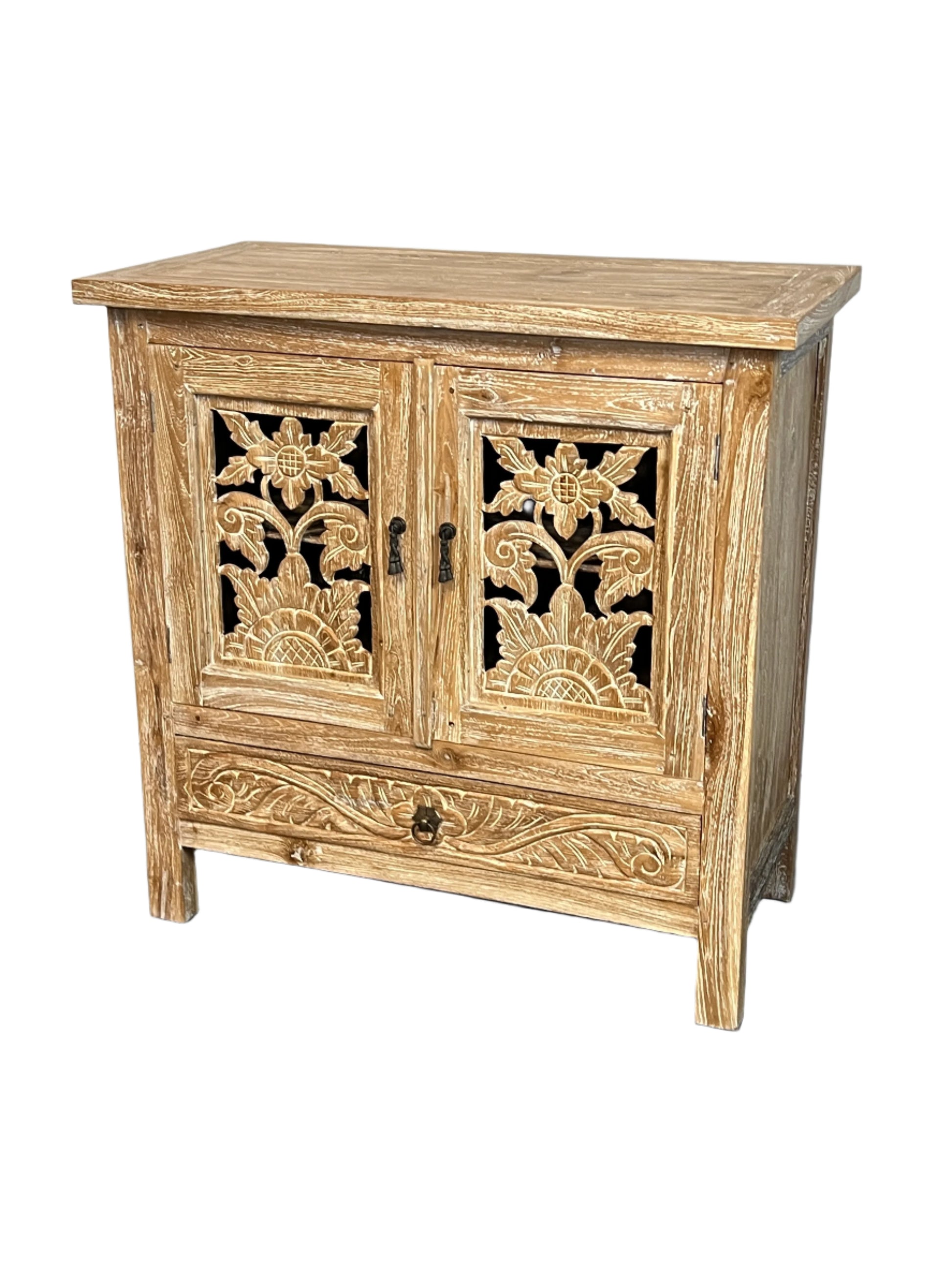 A white washed teak wood vanity with hand made lotus floral carvings on the doors and sides, with a cabinet and drawer compartment.