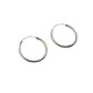 Pair of silver hoop earrings on a light gray background