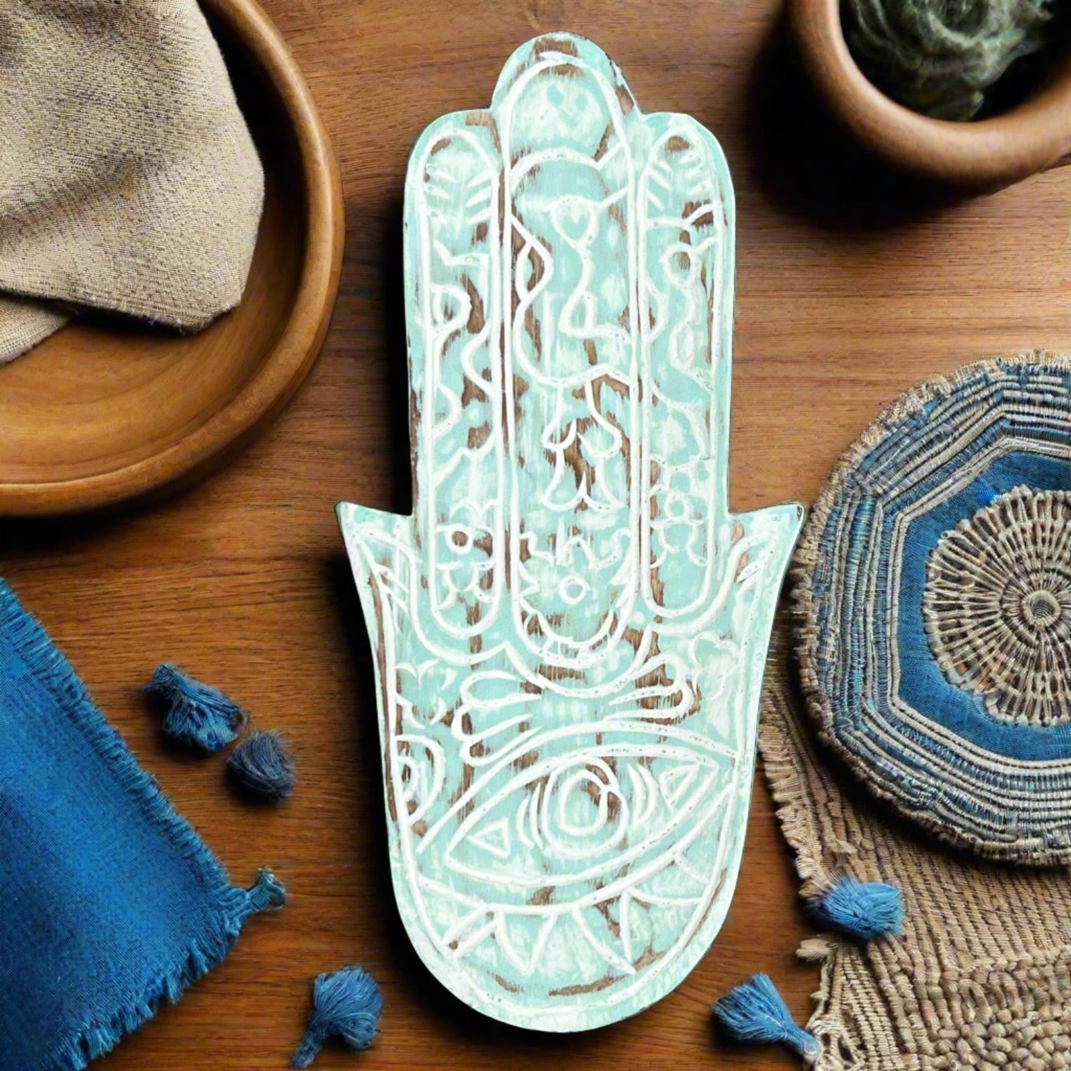 hand carved hamsa hand blue wood plate, from above