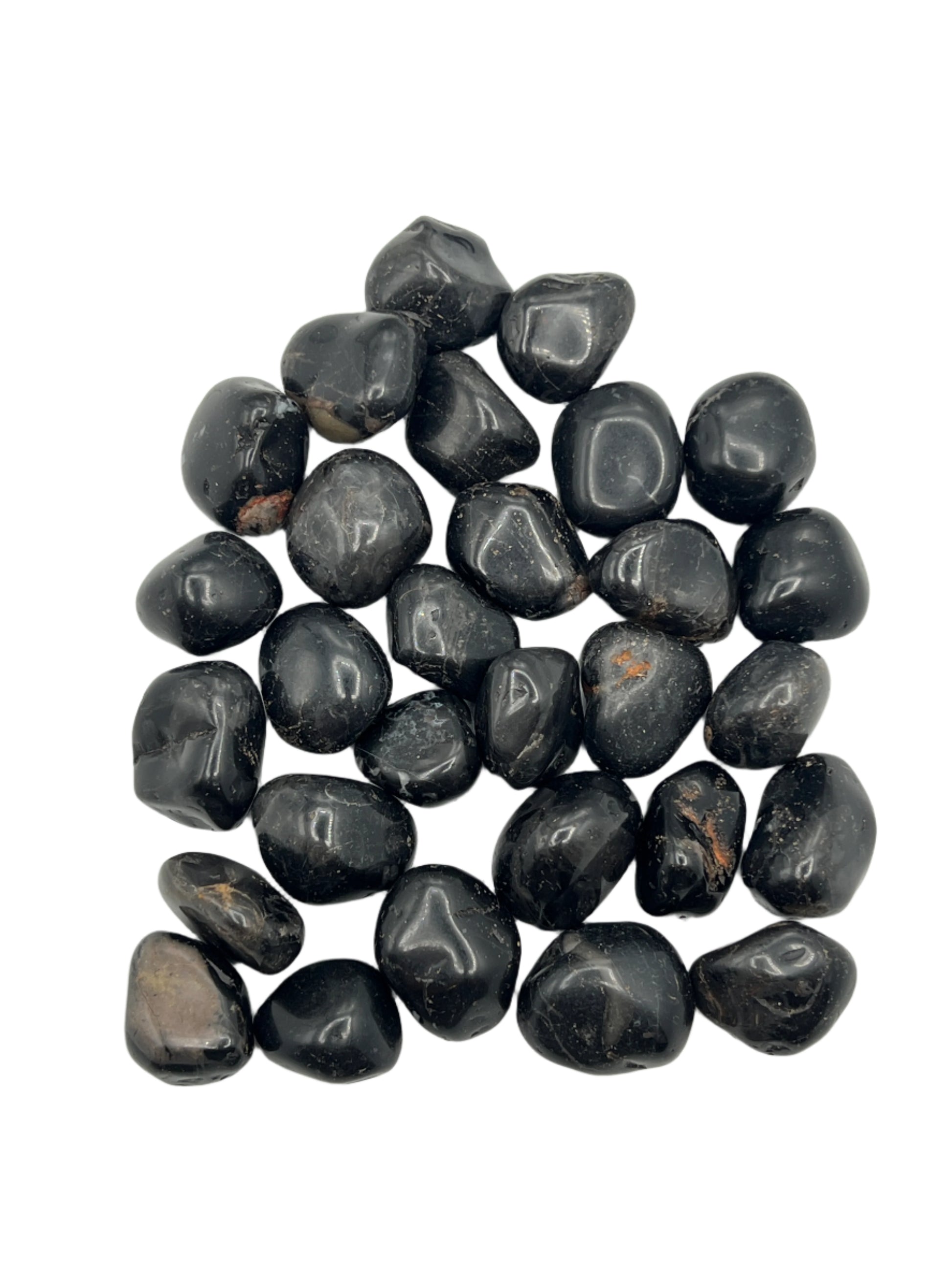 Collection of black onyx stones on a white background