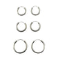 Set of six silver hoop earrings on a gray background