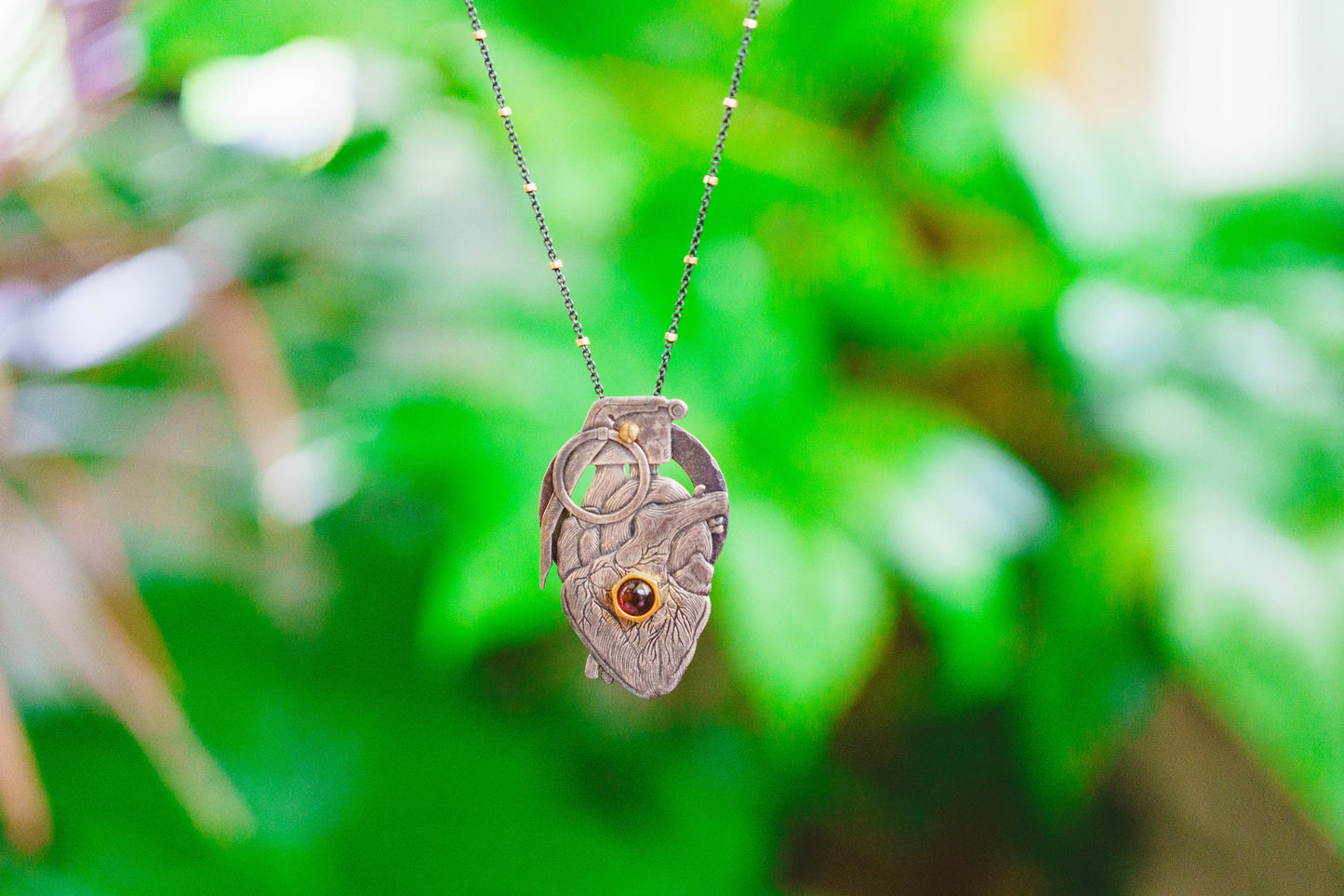 Heart Grenade Necklace by Carlos Montanaro & Crystal Rivera