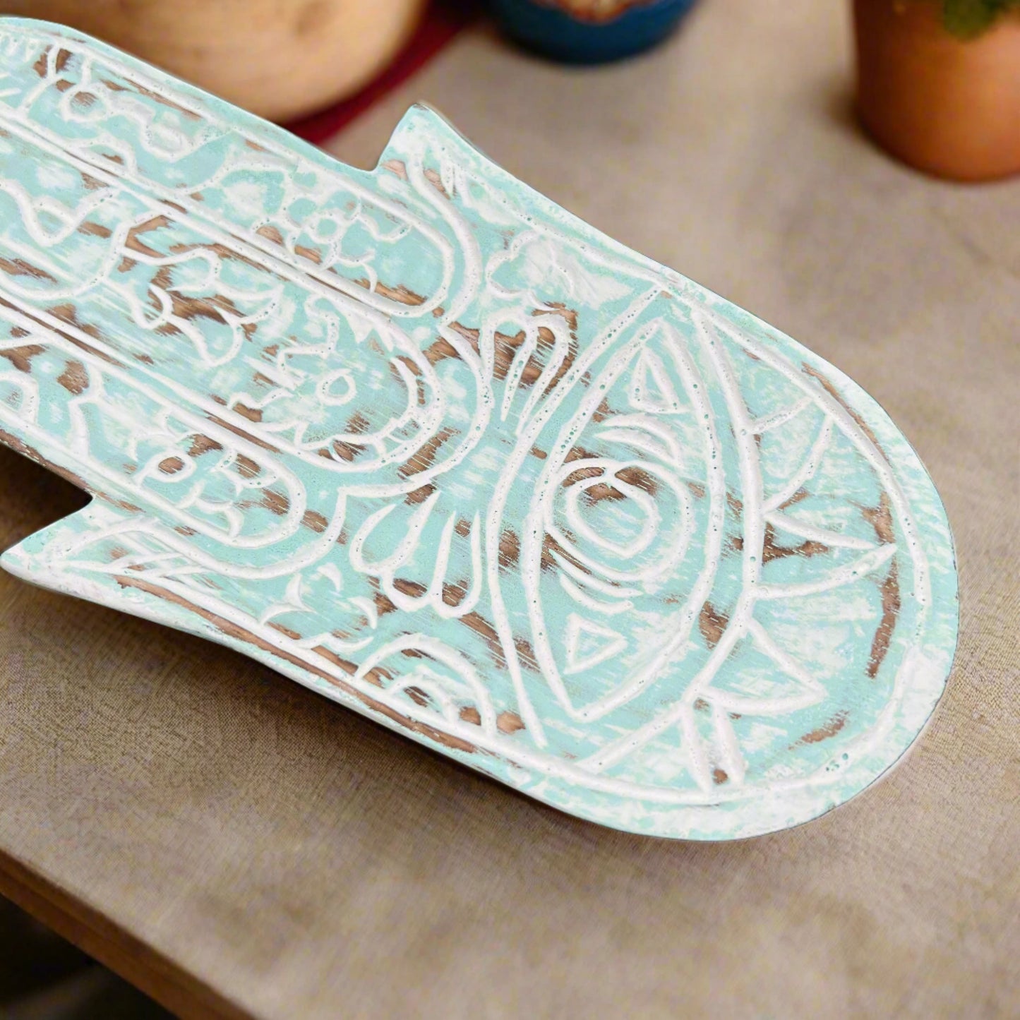 hand carved hamsa hand blue wood plate, upclose 