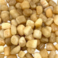 Close-up of small beige stones on a white background