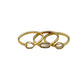 Three gold rings with embedded stones on a white background