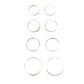 Set of silver hoop earrings on a gray background