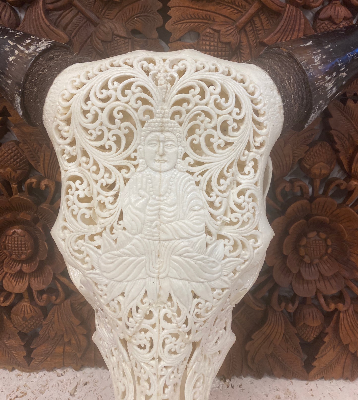 Intricately Carved Buffalo Skulls with Buddha